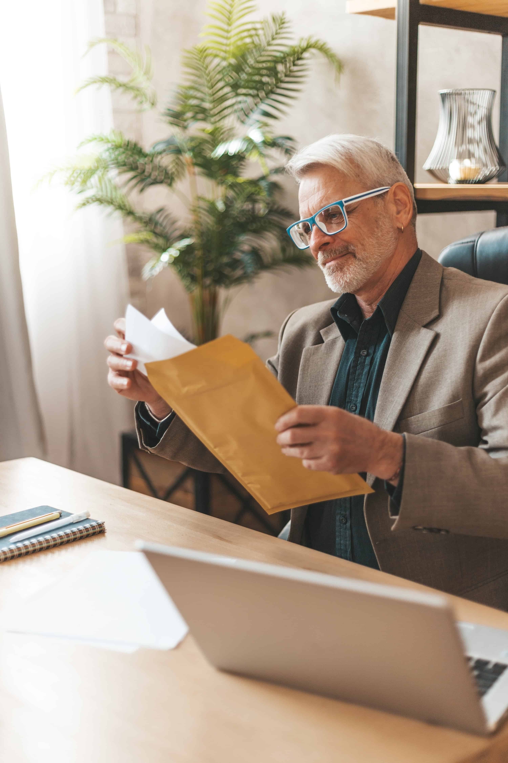 Mature Business guy studying docs