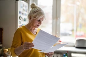 Mature woman looking at docs